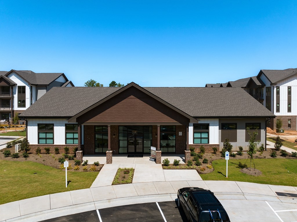 a house with a driveway and a car in front of it