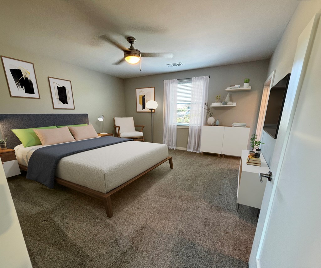 A bedroom with a bed, a ceiling fan, and a window with curtains.