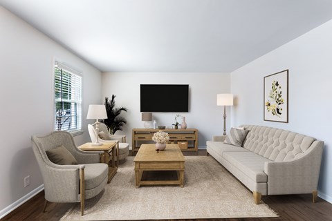 a living room with a couch and two chairs