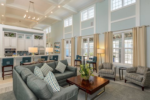 A living room with a grey couch and a coffee table.