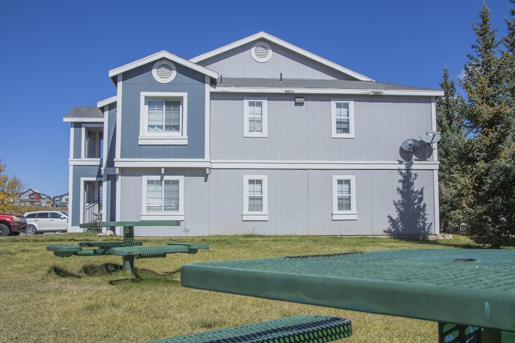 a large white building with a fountain in front of it