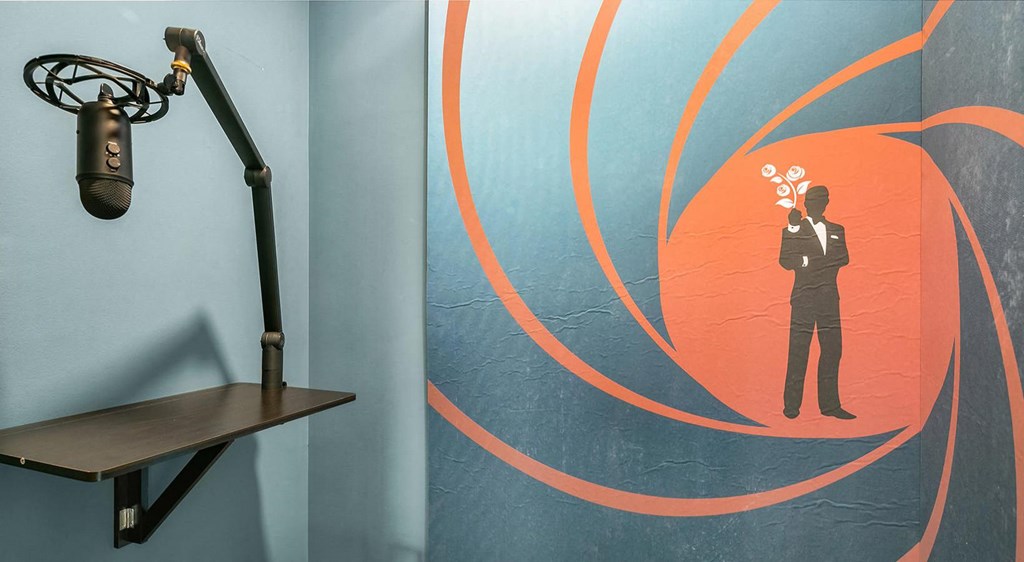 a painting of a man in a suit holding a lightbulb in front of his face