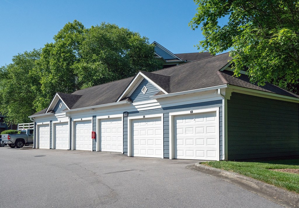 a row of garages in front of a house