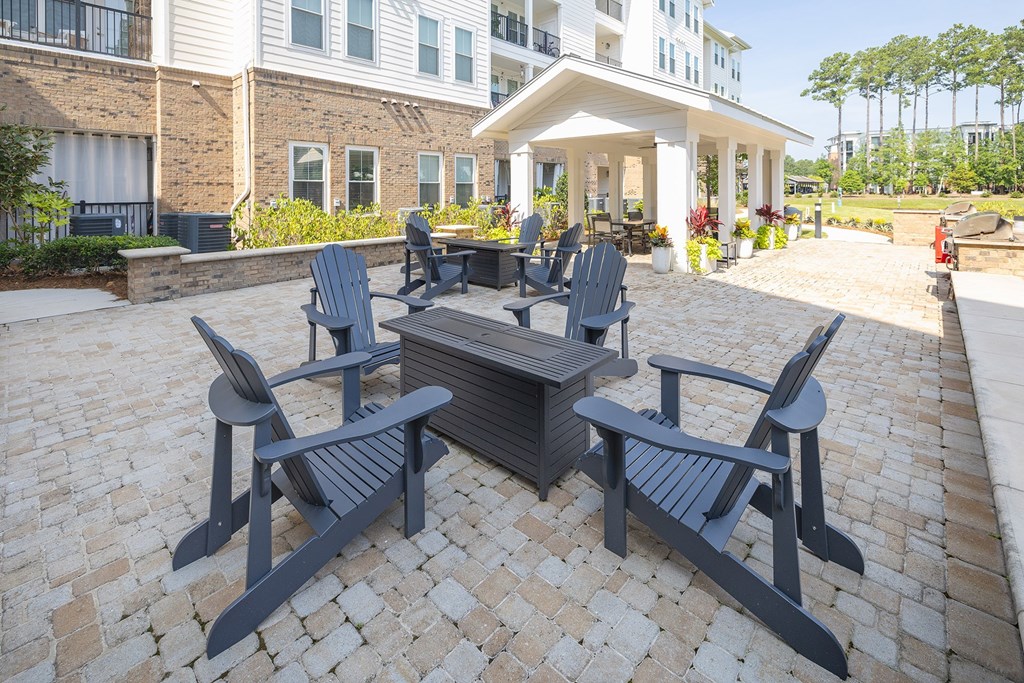 A patio with a table and chairs.