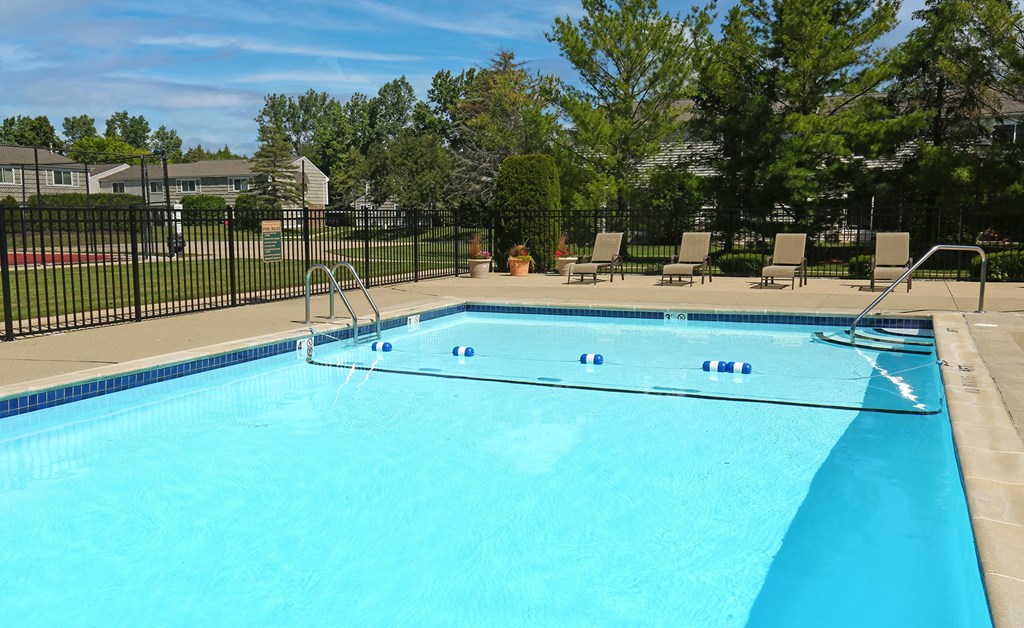 our apartments showcase a swimming pool  at Pheasant Run, Saginaw, MI