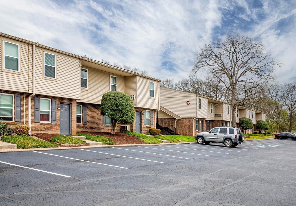 a parking lot with a car parked in front of a building