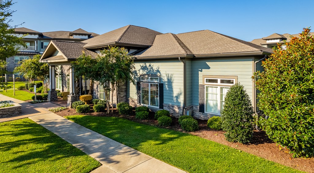 a home in a neighborhood with green lawns and trees