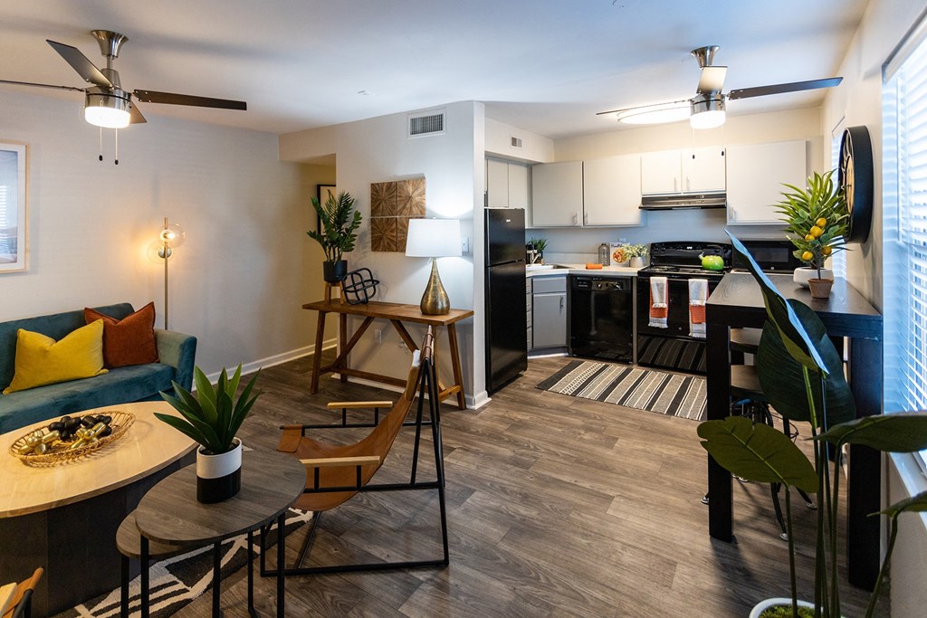a living room and kitchen in a two bedroom apartment