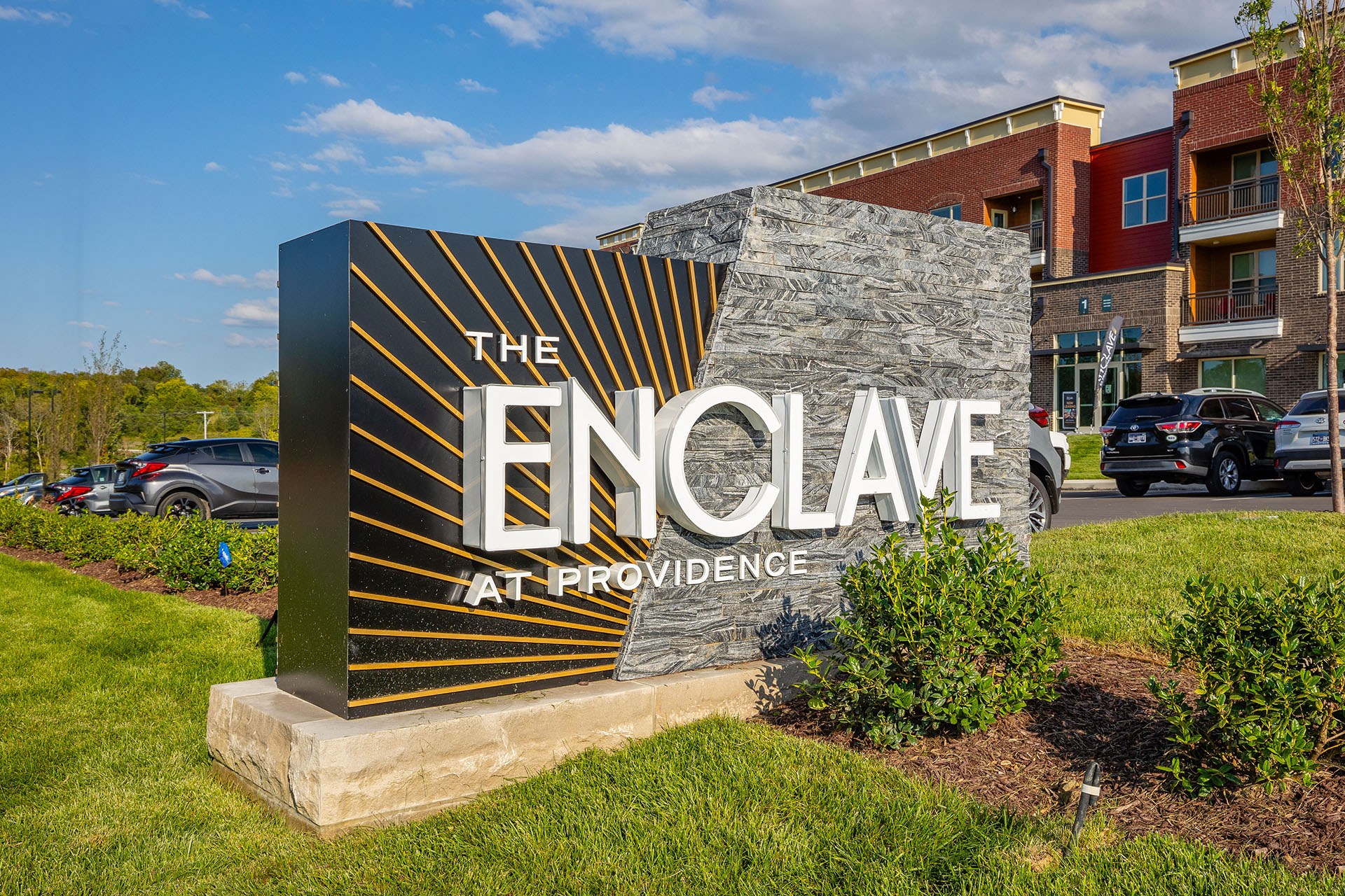 a monument sign for the enclave at providence