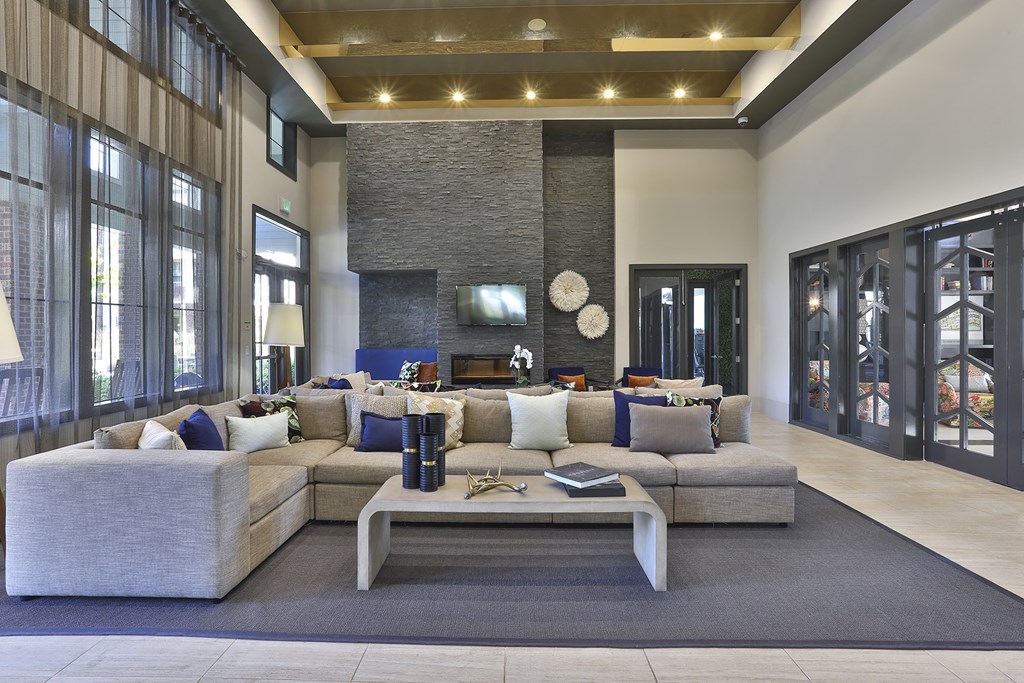 a large living room with a large couch and a coffee table