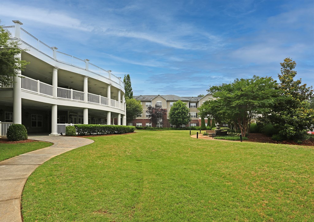 a reflection of some buildings in a glass window
