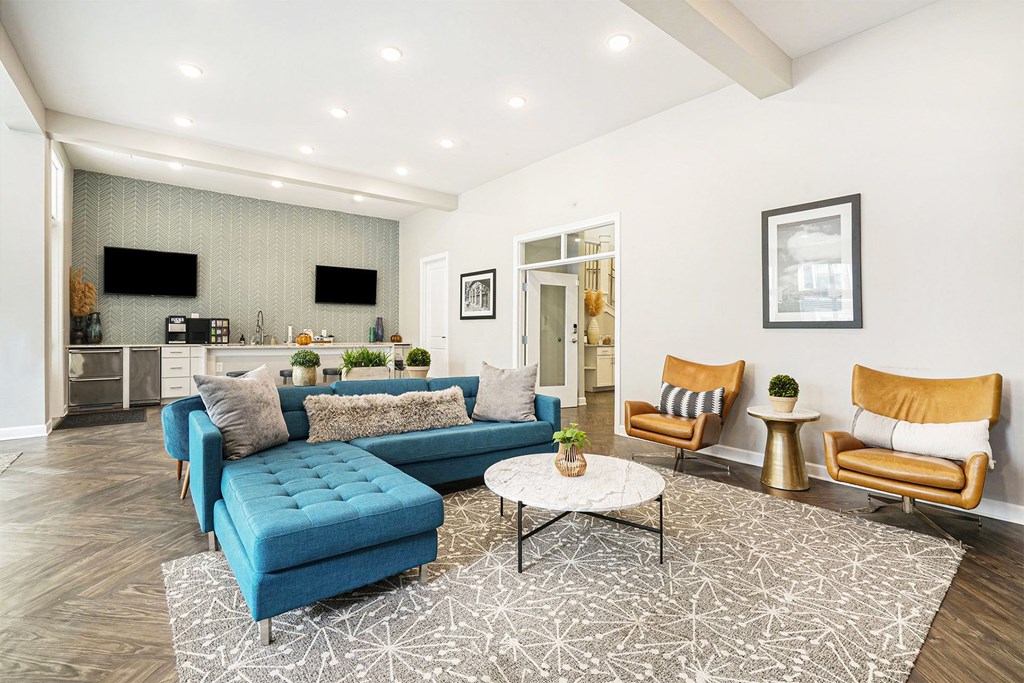 A living room with a blue sofa and a coffee table.