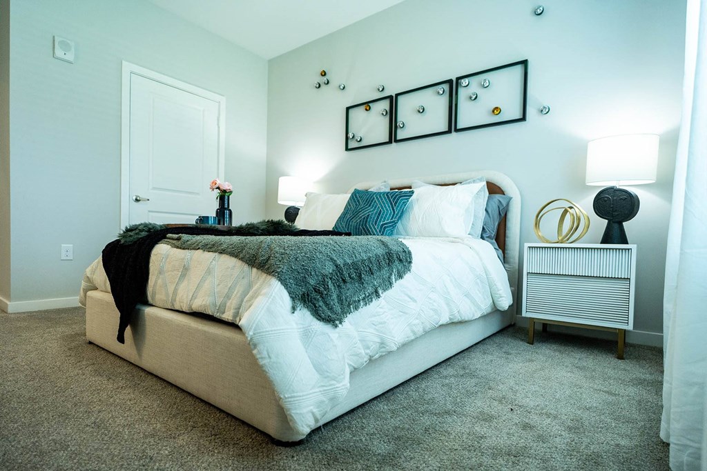 a bedroom with a bed and a nightstand