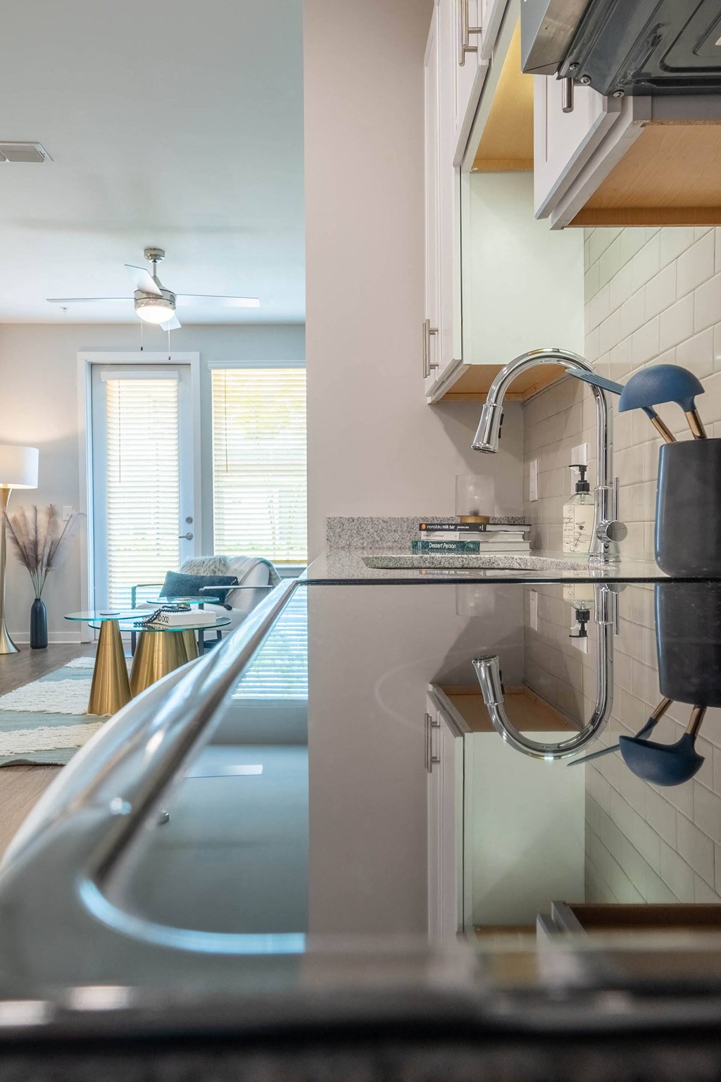 a kitchen with a sink and a refrigerator