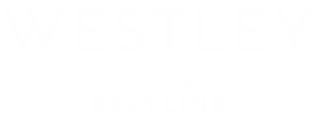 A green sign with white text that reads "WESTLEY ON THE BELTLINE".