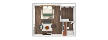A small room with a bed, a table, and a chair.