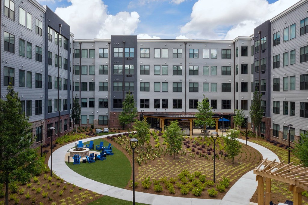 an aerial view of the courtyard of an apartment building