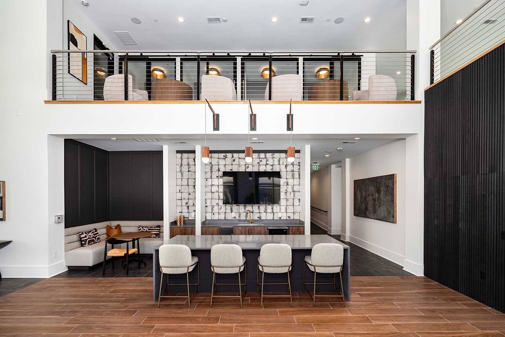 A modern living room with a bar area and a television.