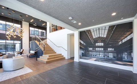 A large open space with a staircase and a large window.
