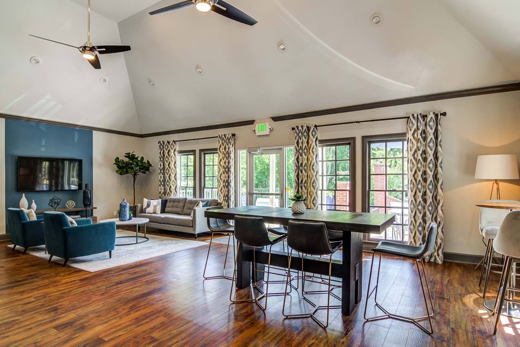 a living room with a table and a couch and a tv