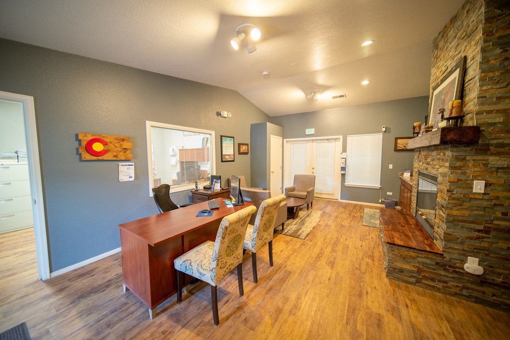 a dining room with a table and chairs and a fireplace