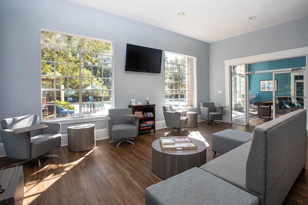 a living room filled with furniture and a flat screen tv