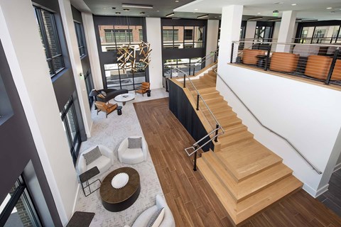 A modern interior with a staircase leading to the upper floor.
