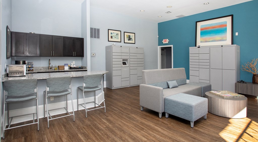 a common room with a kitchenette and couches