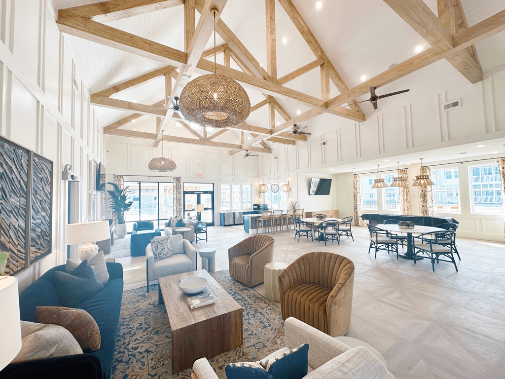 A large, open-plan living area with a piano and multiple seating options.