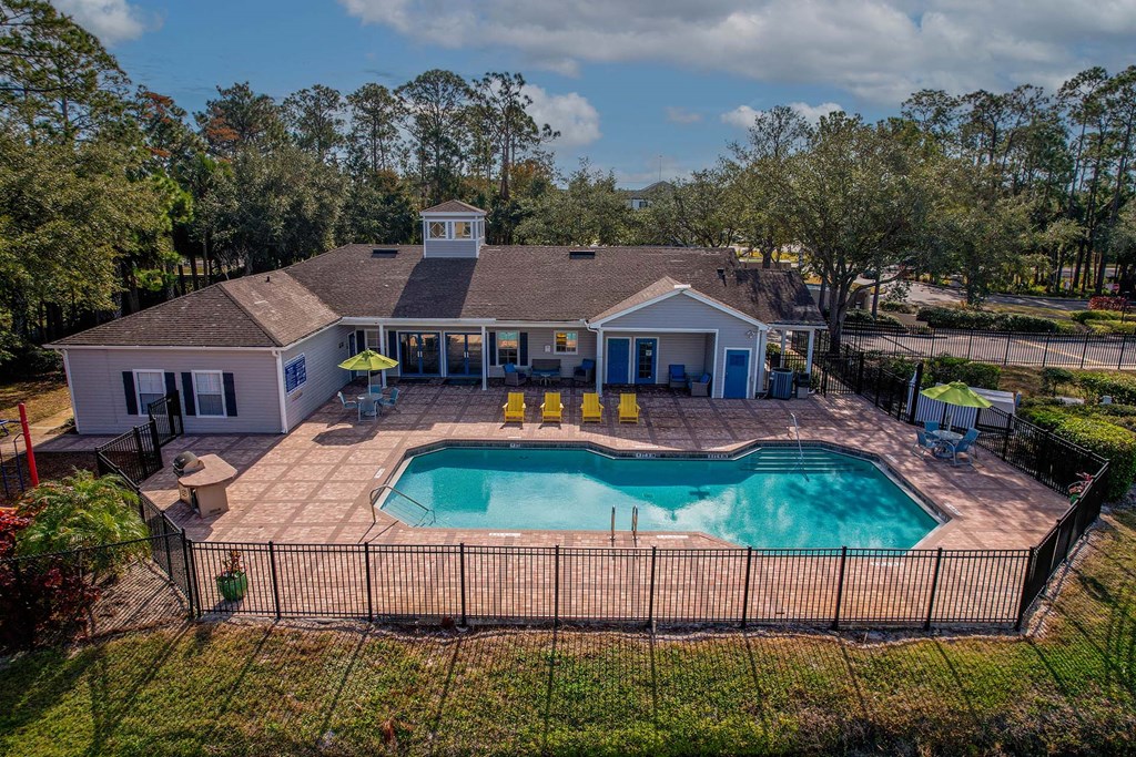 A house with a pool in the backyard.