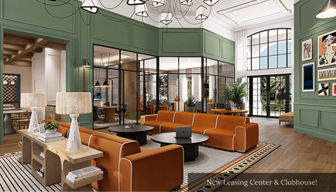 A modern leasing center and clubhouse with orange and green furniture.