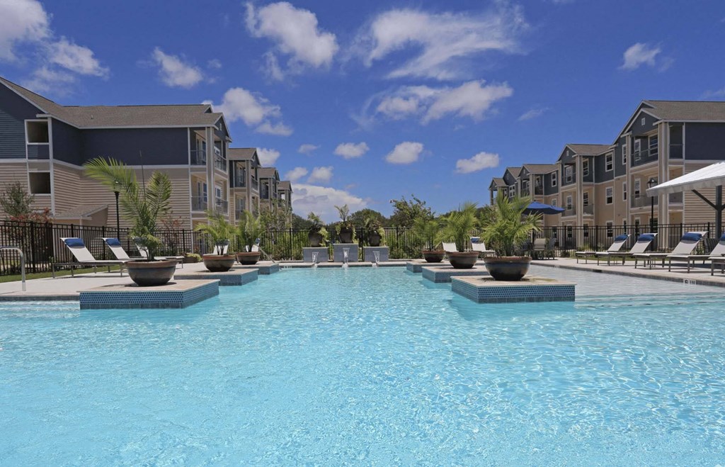 the swimming pool at the estates apartments