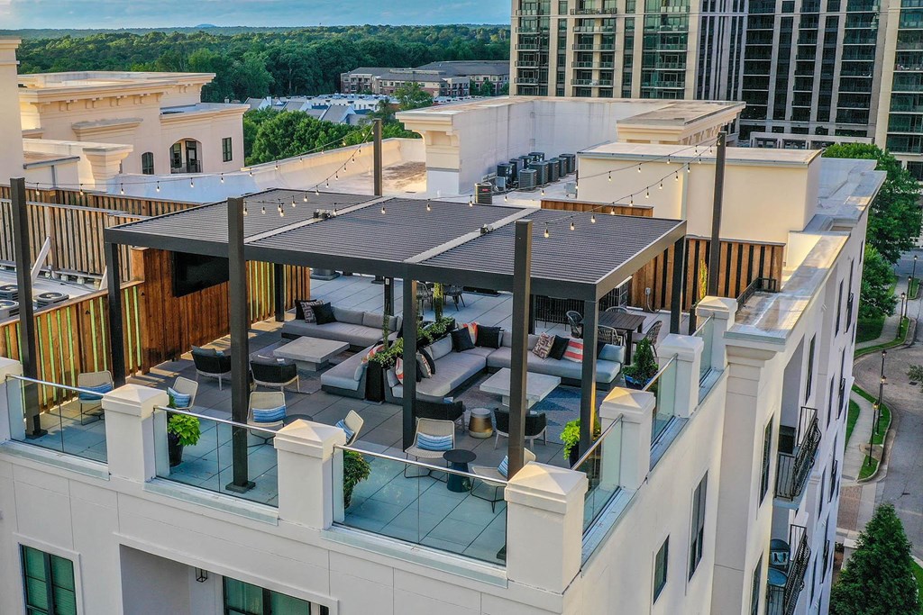 a rooftop bar with a retractable roof