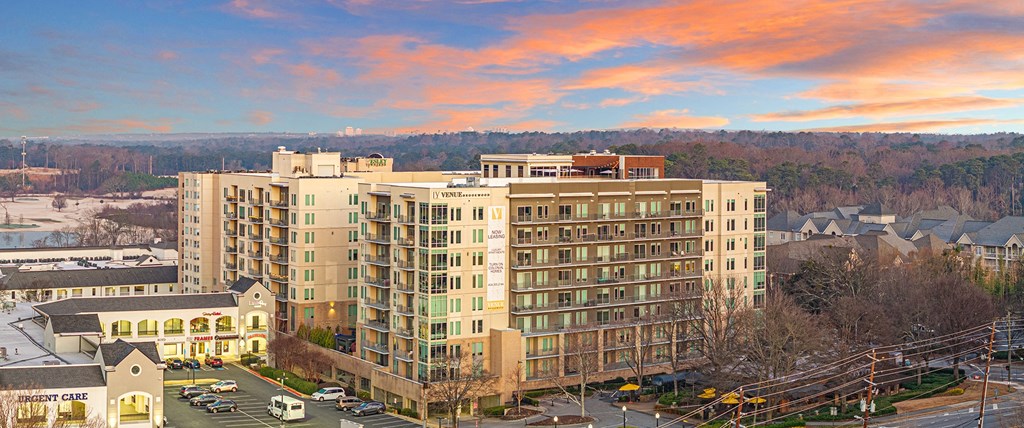an aerial view of a large building on a city street