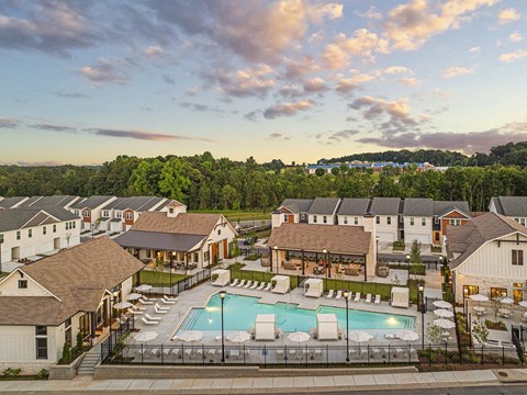 an aerial view of a resort with a swimming pool