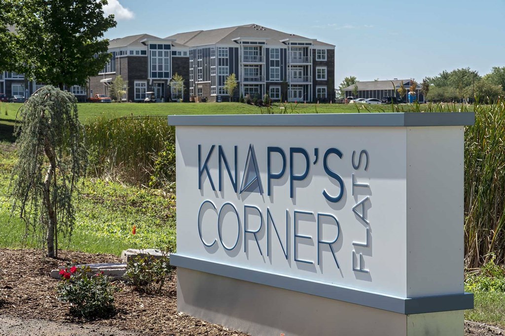Knapp's Corner sign in front of a building.