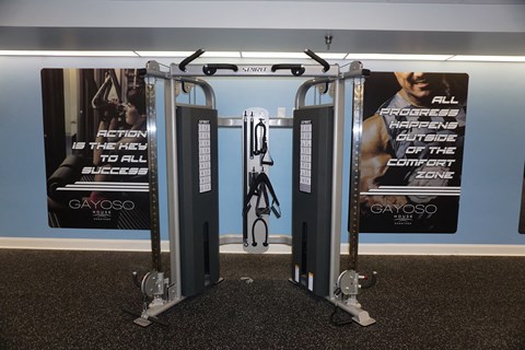 a pair of exercise machines in a gym