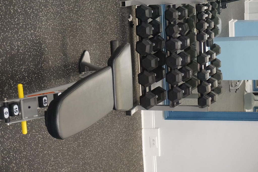 a tool that is cutting a piece of metal on a machine