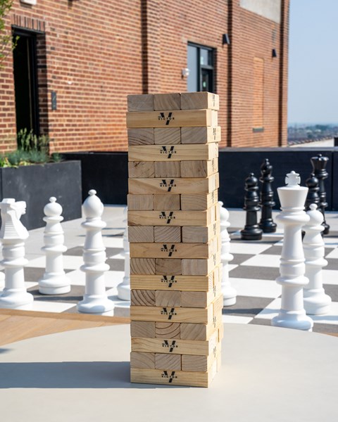 a giant chess board on a rooftop