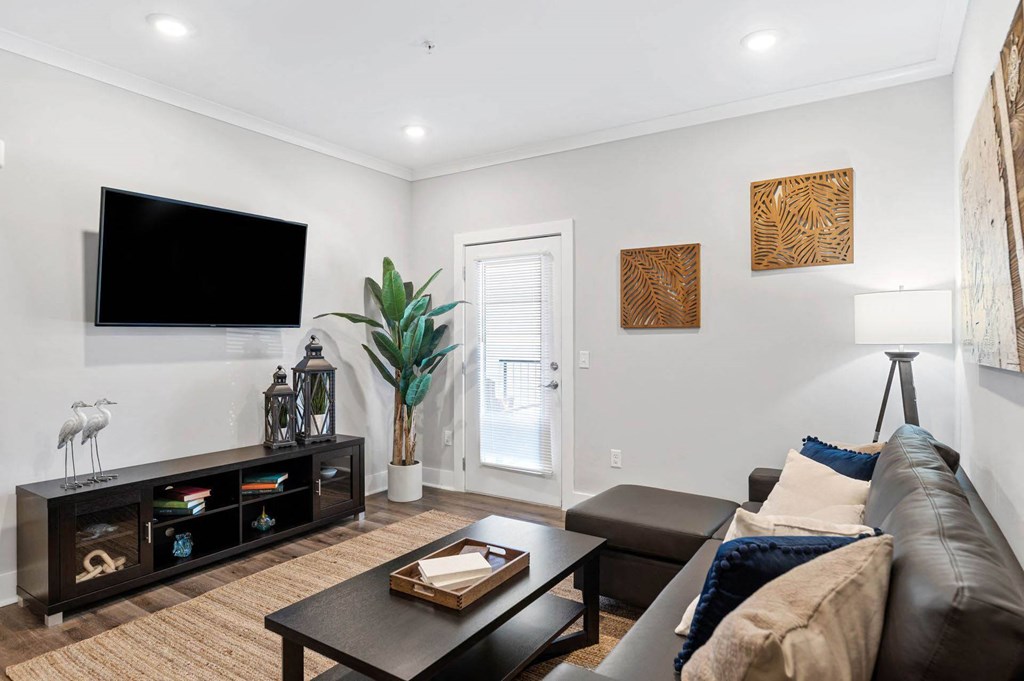 a living room with a couch and a tv