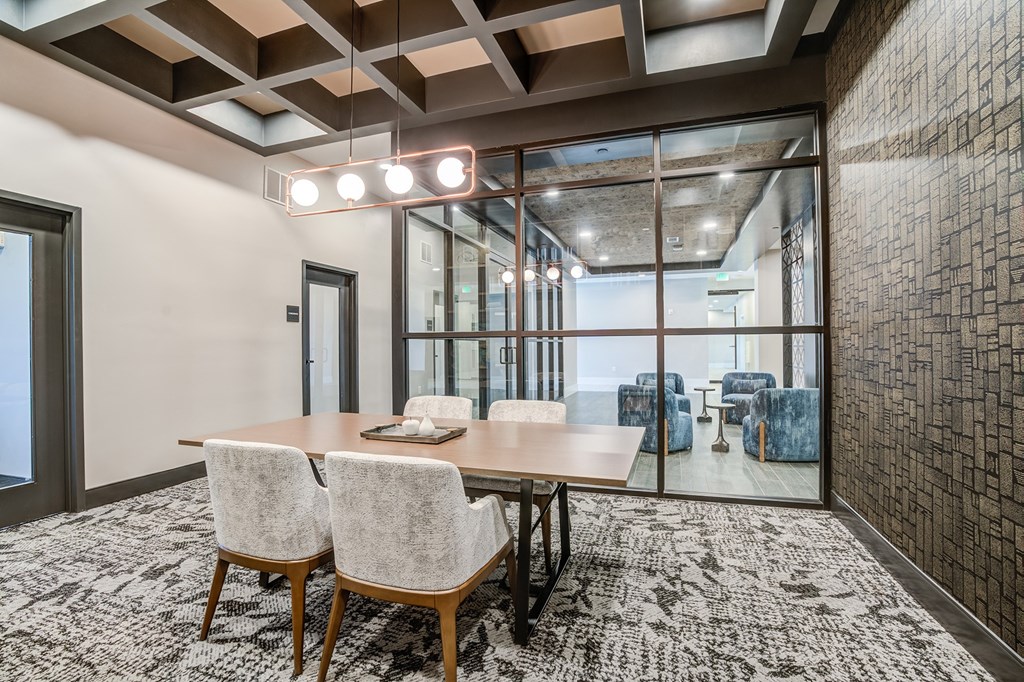 a conference room with a large table and chairs