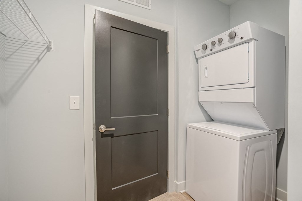 a small laundry room with a washer and dryer