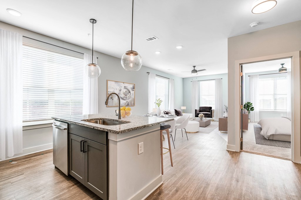 an open floor plan with an island kitchen and living room