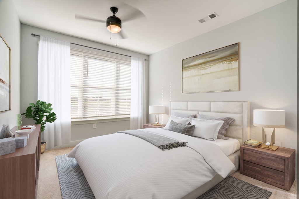 a bedroom with a large bed and a window