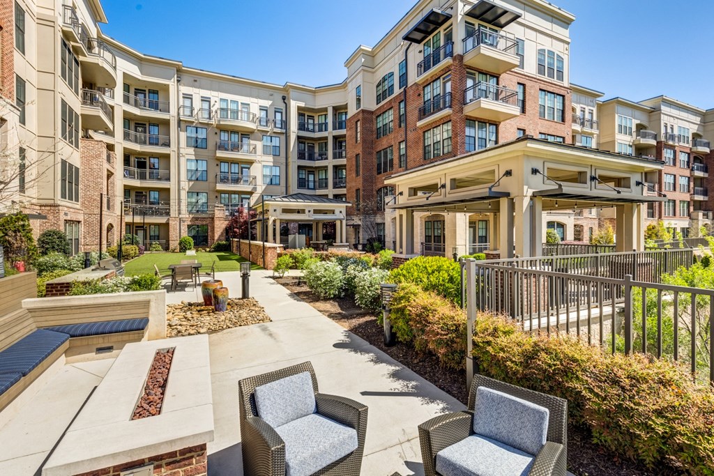 the preserve at ballantyne commons apartments patio with chairs and landscaping