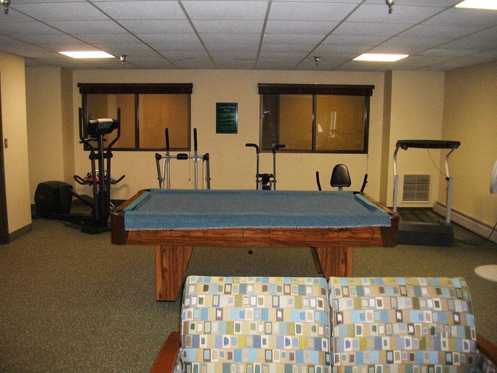 a pool table with a blue cloth on top of it