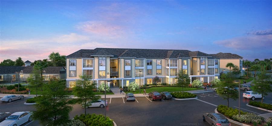 a rendering of an apartment building in a parking lot