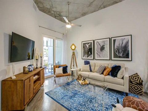 a living room filled with furniture and a flat screen tv at Altis Grand Central, Florida