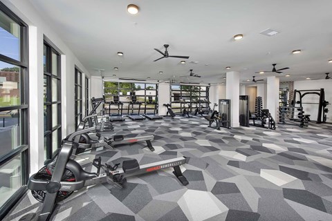 A gym with treadmills and exercise equipment.
