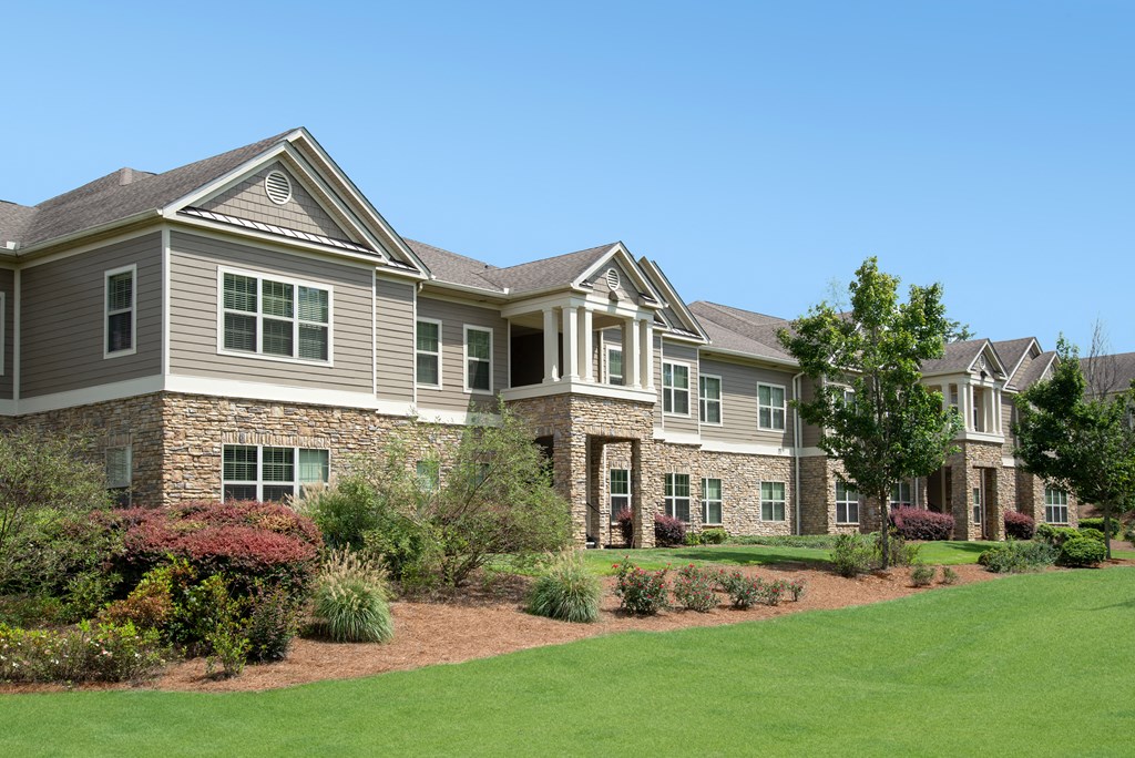a house with a lawn and a yard in front of it